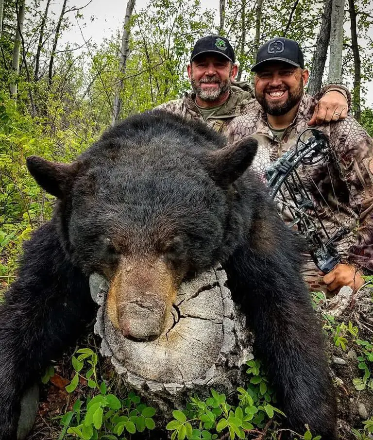 Jarod-Griffith-Client-Alaska-Black-Bear-Archery-Bait-AOU4 » Outdoors International Russ and OI client Jared Griffith with a nice Alaska black bear they hunted over bait.