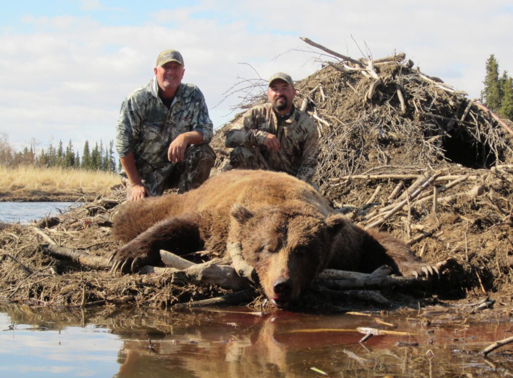 Cory Glauner and Outdoors International client Bruce Templeton with a giant 10' 4" Alaska Peninsula brown bear.