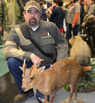 Mat Cervantes with a mounted muntjac deer