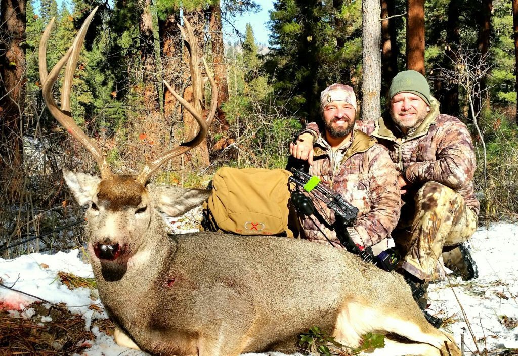 Russ and Cory with Cory's late season archery mule deer Cory and Russ with Cory's deer