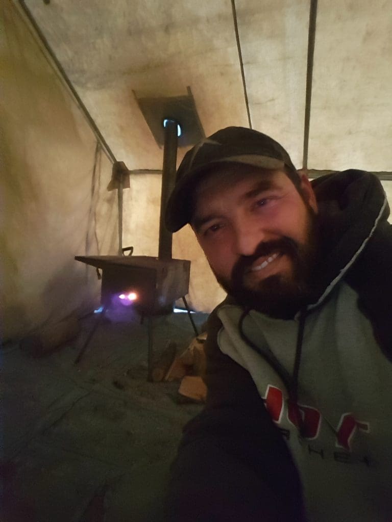 Cory Glauner late season deer hunting out of a wall tent Cory Glauner at base camp