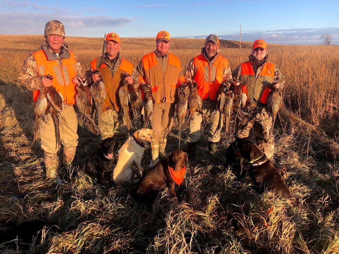 A group of happy pheasant hunters
