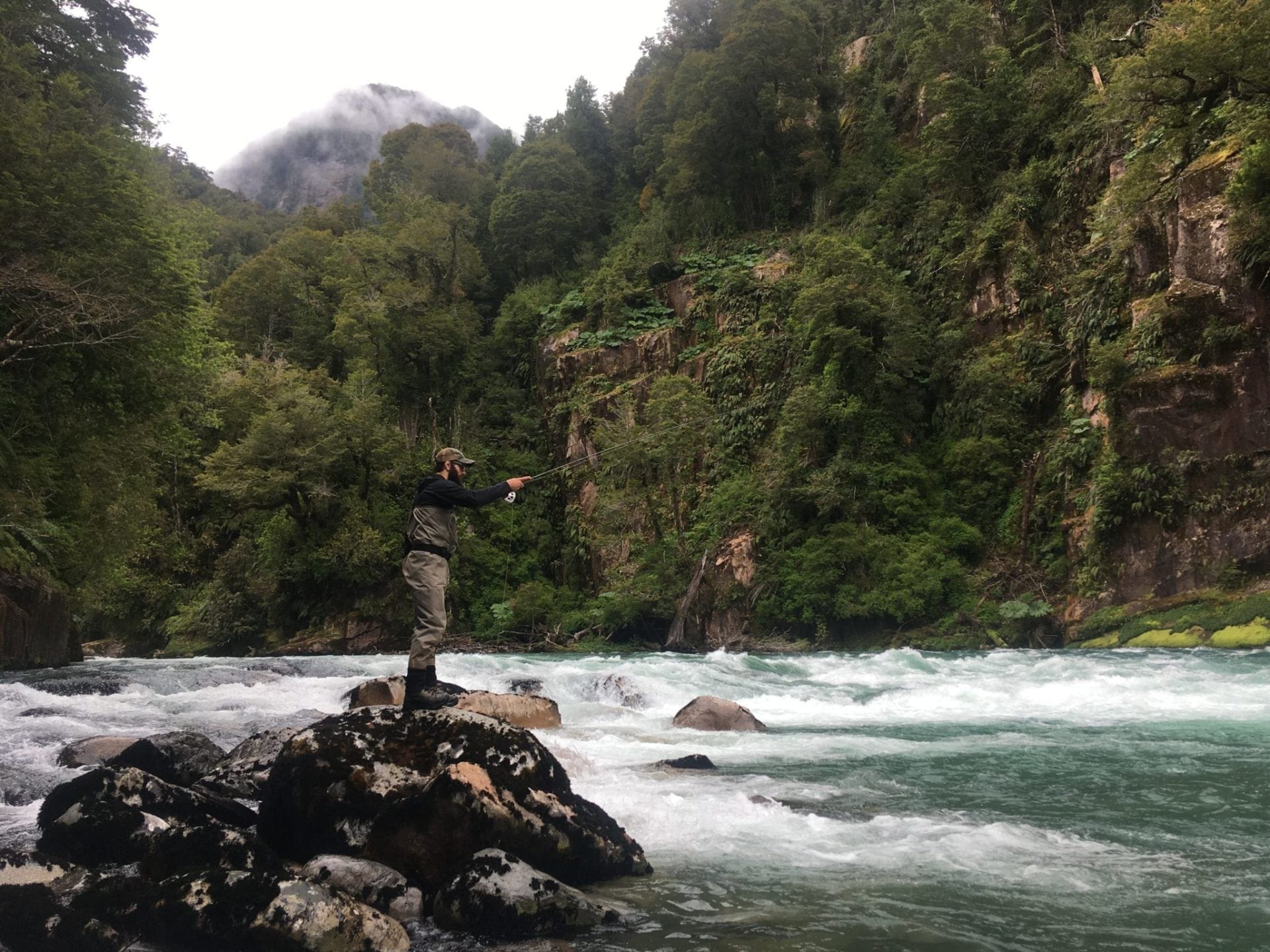 Fly fishing on the rocks in the Patagonia canyon