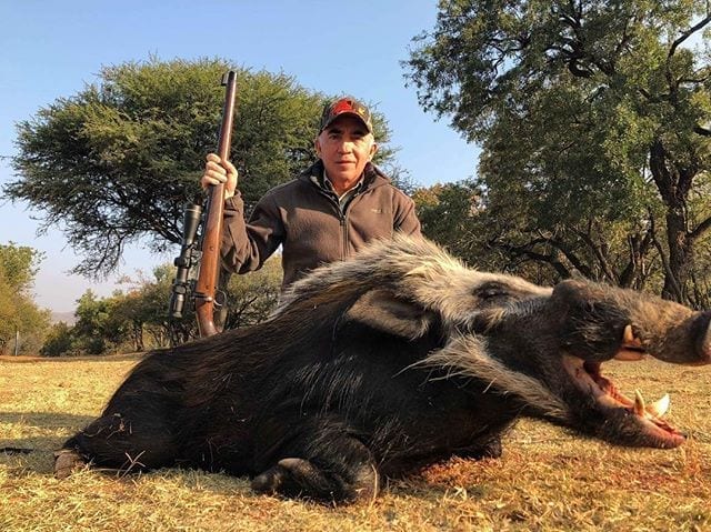 Dason Lasater's dad with a giant Bushpig.