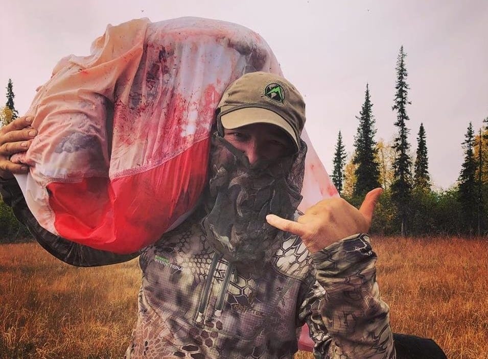 Cory Glauner packing out a moose.