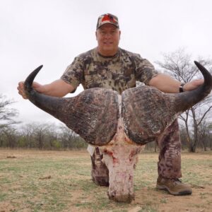 Tom White with a huge cape buffalo