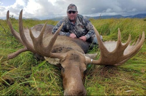 Clint Stephenson with a big guided bull moose.