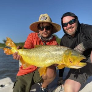Client and guide with Golden Dorado