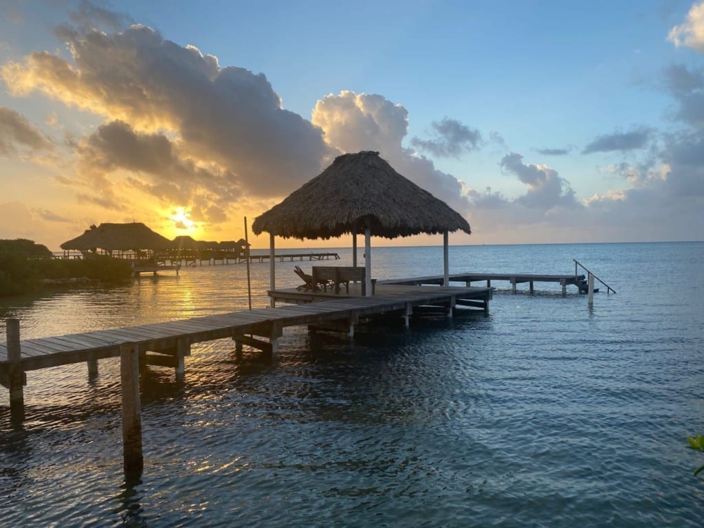 Watching sunrise from the dock in Belize