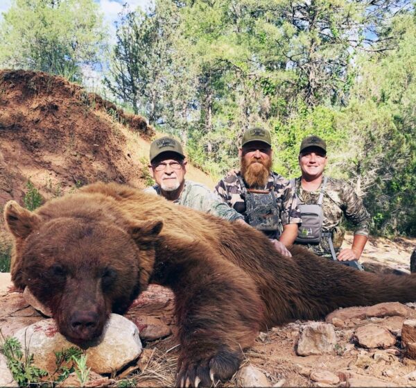 Outdoors International client Michael Hickey with a giant Arizona black bear.