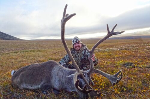 Outdoors International client Mitch Glantz with a nice Alaska caribou he took on a DIY drop hunt.