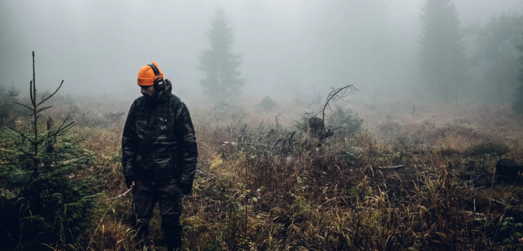 » Outdoors International Hunter wearing ear protection