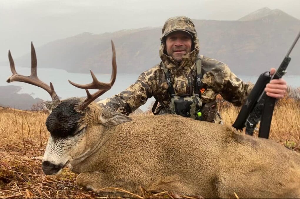 Outdoors International Client Joel Kissel with a great Kodiak blacktail.