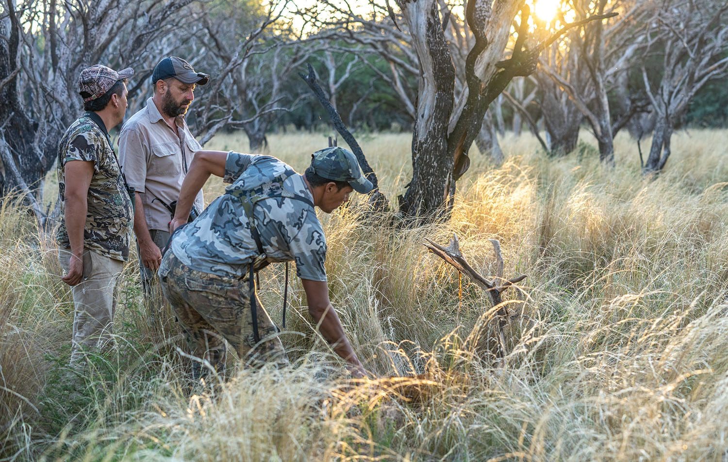 Argentina Free Range Red Stag Hunters admiring a stag » Outdoors International Hunters admiring their stag