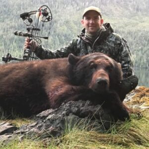 Gary Colbath with a great archery color phase black bear he killed in Alaska.