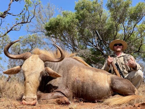 Africa-King-Wildebeest-Limpopo-District-SA-Oct-2-2022 Sep-30-20221 Thomas Driskill Client DWHS » Outdoors International Thomas' son with a fine King Wildebeest