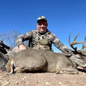 One of our clients with a giant Coues deer he took in Mexico.