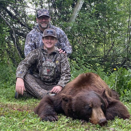 Bert Chandler and his grandson with a beautiful BC black bear.