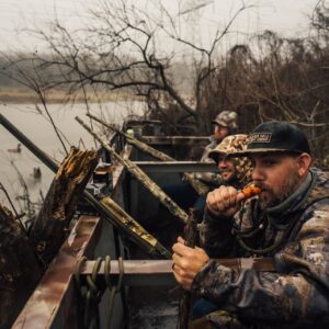 Duck hunters calling in a blind