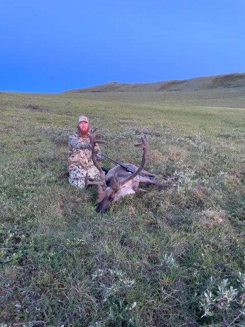 Jake Slane with a caribou