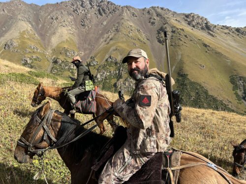 Cory Glauner riding a horse in Kazakhstan