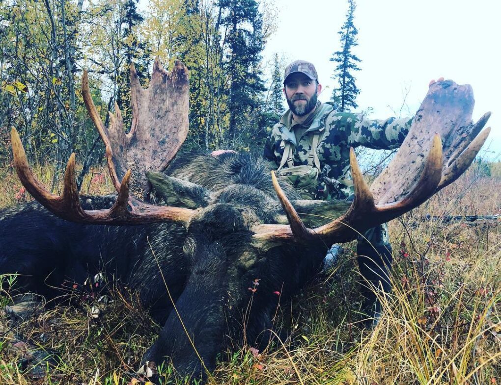 Brandon Couchman with an unguided moose.