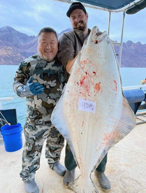Outdoors International client Dan Koshiyama with a 115 pound Kodiak Island halibut.