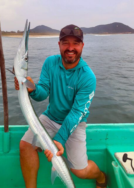Cory Glauner with a big Needlefish he caught while fishing inshore for Roosterfish