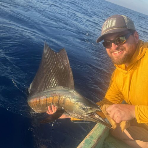 Andrew with his first sailfish.