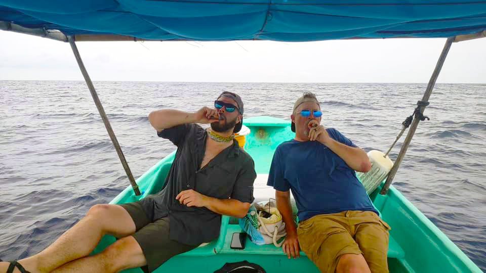 Smoking cigars after a day of catching sailfish.