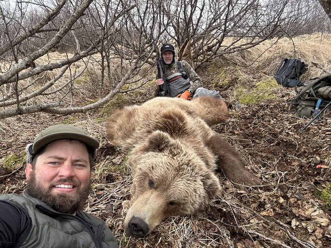 OI client John LeBanc with his 2024 spring brown bear he hunted on the Alaska Peninsula.