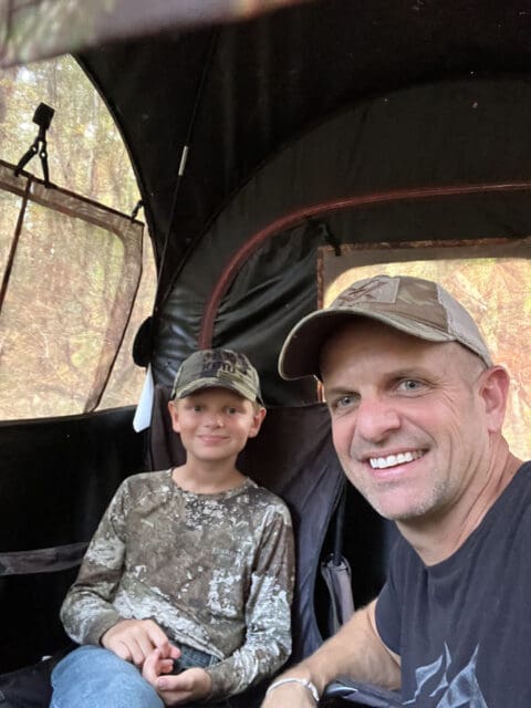 Sitting in the blind with his son.