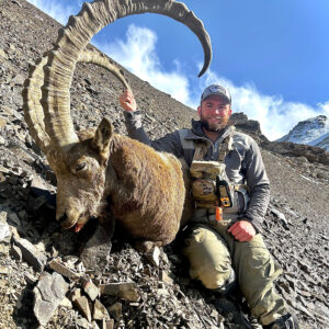 Max DeMarco with a giant ibex he hunted in Kyrgyzstan