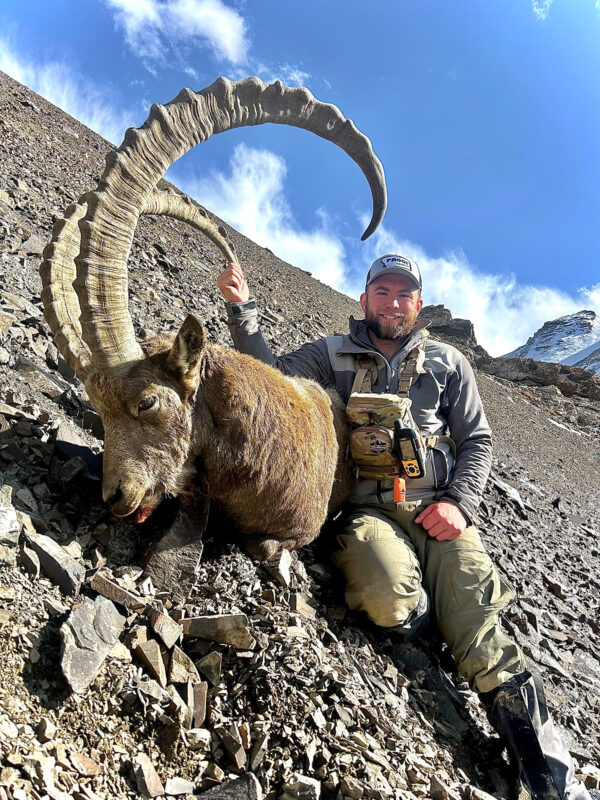 Max DeMarco with a giant ibex he hunted in Kyrgyzstan