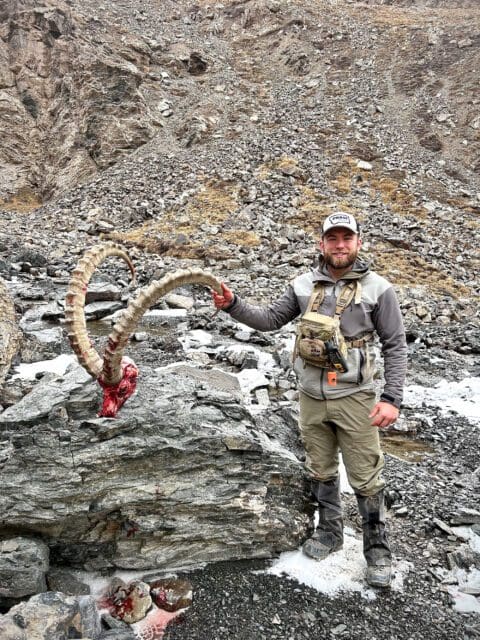 Max DeMarco with a giant ibex he hunted in Kyrgyzstan