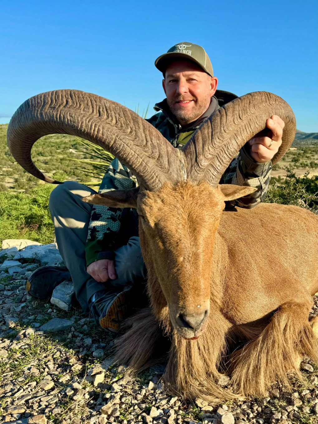 Dustin Catrett with his Texas Aoudad he hunted on Ox Ranch in Uvalde Texas