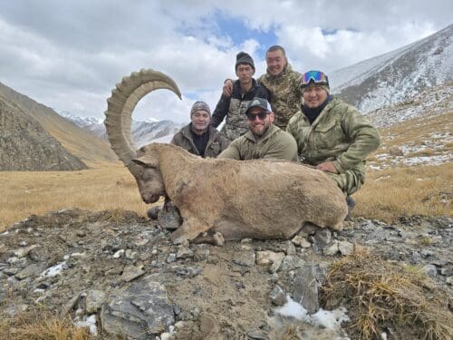 Kyle and his guides with his ibex
