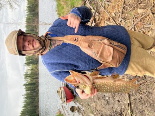 Daniel Driskell with a Northern Pike he caught.