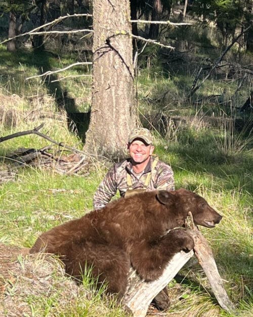 Charlie with his first black bear