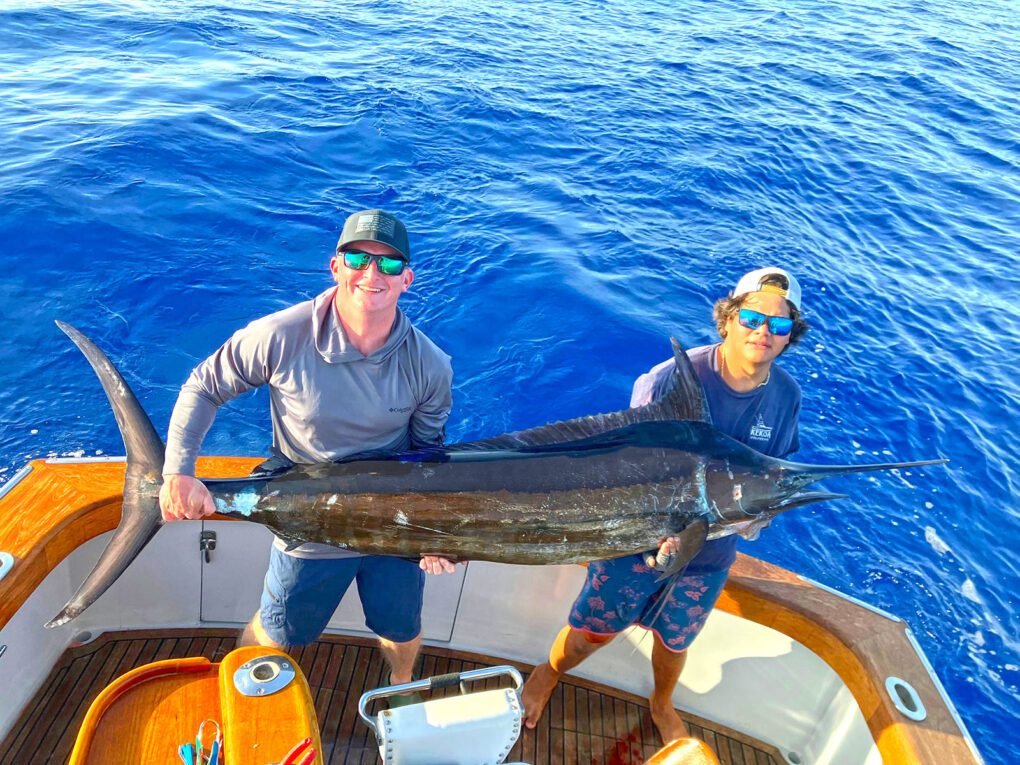 Kevin with a giant Blue marlin he caught with our outfitter on the Big Island of Hawaii.