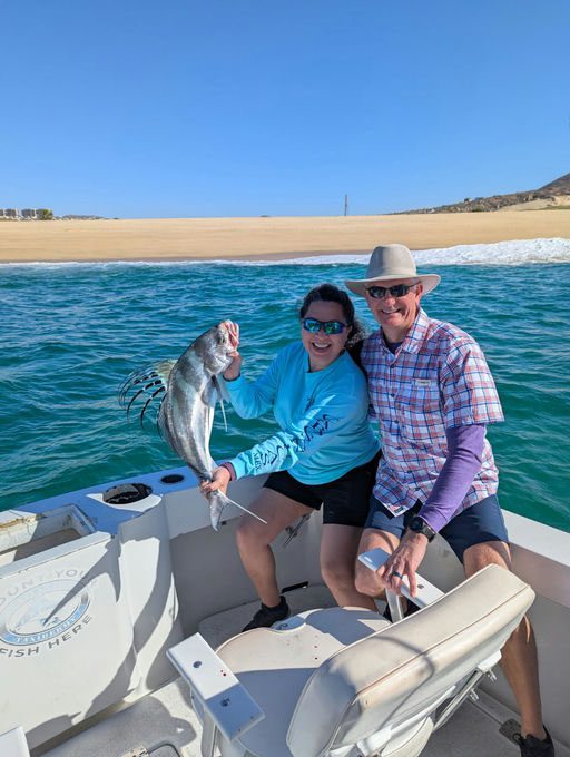 Yvonne with a nice roosterfish she caught in Mexico with our guides out of Cabo.