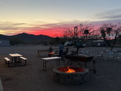 Jake Hanning — desert camp at sunset with fire pit (Mexico, 2026)