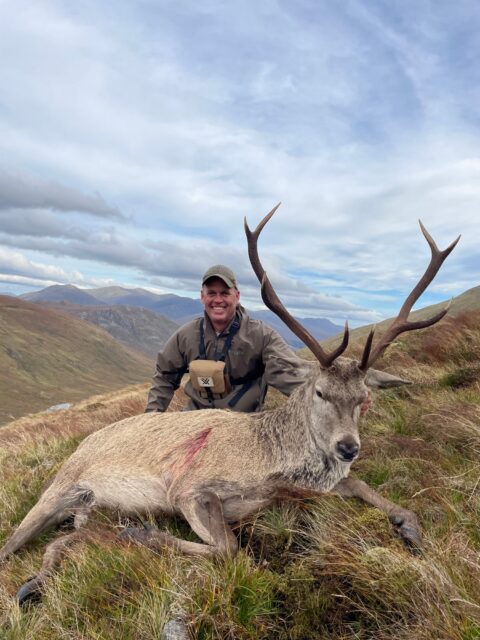 Kyle Apple — red stag on Scottish highland hillside (Scotland, 2026)