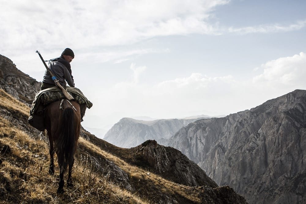 Riding horses in Kyrgyzstan on an ibex hunt